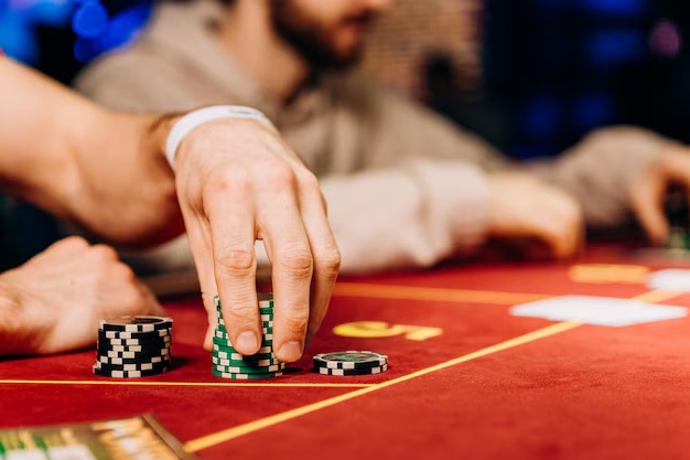 Live dealer spinning the roulette wheel at high speed